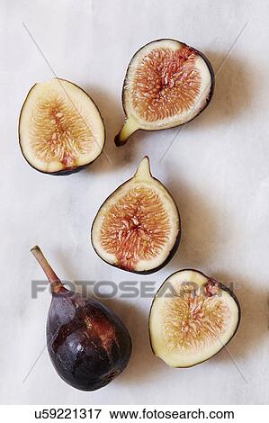 Stock Photo - Figs lying on marble table. Fotosearch