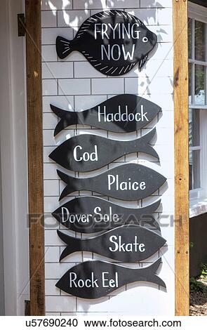 Stock Image - Fish shaped signs at fish shop, Southwold, Suffolk, UK. Fotosearch