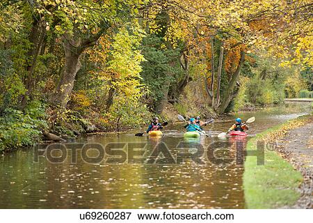 Four kayakers paddling on River Dee, Llangollen, North Wales View Large Photo Image Stock Photo - Four kayakers paddling on River Dee, Llangollen, North Wales. Fotosearch
