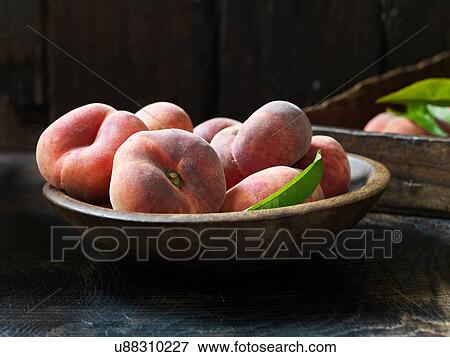 Fresh organic fruit, donut peaches View Large Photo Image Stock Photo - Fresh organic fruit, donut peaches. Fotosearch