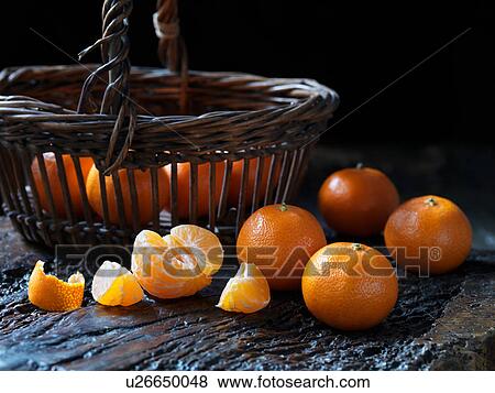 Stock Photo - Fresh organic fruit, tiny tangerines. Fotosearch