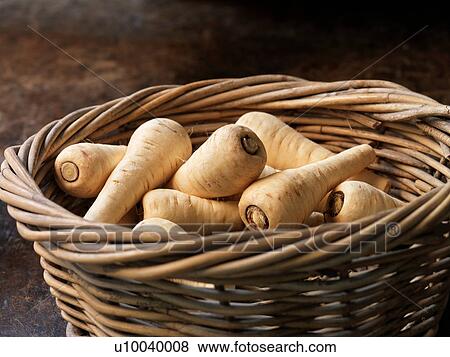 Stock Photo - Fresh organic vegetables, baby parsnips. Fotosearch