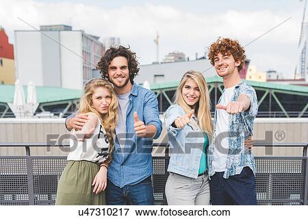 Friends giving thumbs up View Large Photo Image Stock Photo - Friends giving thumbs up. Fotosearch