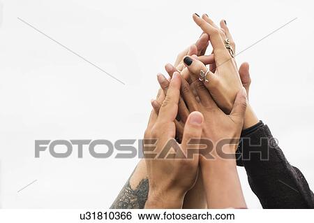 Friends holding their hands together View Large Photo Image Stock Photograph - Friends holding their hands together. Fotosearch