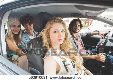 Friends sitting in car View Large Photo Image Stock Image - Friends sitting in car. Fotosearch