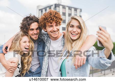Friends taking selfie outdoors View Large Photo Image Stock Photo - Friends taking selfie outdoors. Fotosearch
