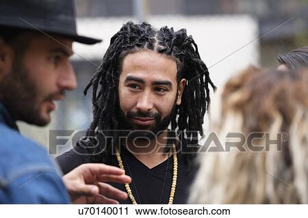 Friends talking outdoors View Large Photo Image Stock Image - Friends talking outdoors. Fotosearch