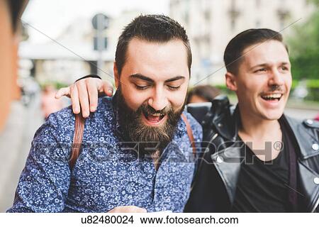 Picture - Friends walking on sidewalk. Fotosearch