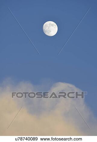 Stock Photo - Full moon on blue sky. Fotosearch