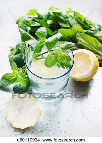 Glass of water with lemon and mint View Large Photo Image Picture - Glass of water with lemon and mint. Fotosearch