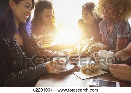 Group of friends in cafe View Large Photo Image Stock Image - Group of friends in cafe. Fotosearch