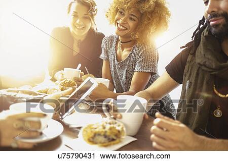 Group of friends in cafe View Large Photo Image Stock Image - Group of friends in cafe. Fotosearch