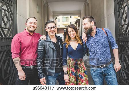 Group of friends in front of building entrance View Large Photo Image Stock Photo - Group of friends in front of building entrance. Fotosearch