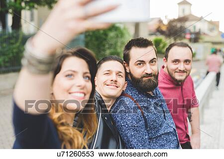 Group of friends taking selfie by roadside View Large Photo Image Stock Image - Group of friends taking selfie by roadside. Fotosearch