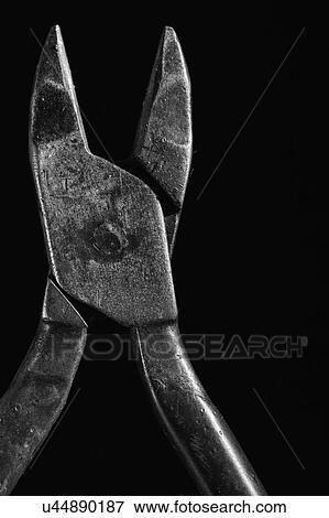Stock Photo - Hand tool against black background. Fotosearch