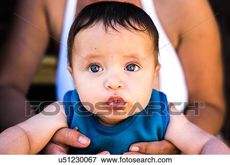 Stock Photo - Happy baby boy on summer day. Fotosearch