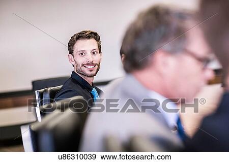 Happy businessman in board meeting View Large Photo Image Stock Photo - Happy businessman in board meeting. Fotosearch