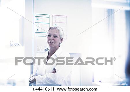 Stock Image - Happy scientist in laboratory. Fotosearch