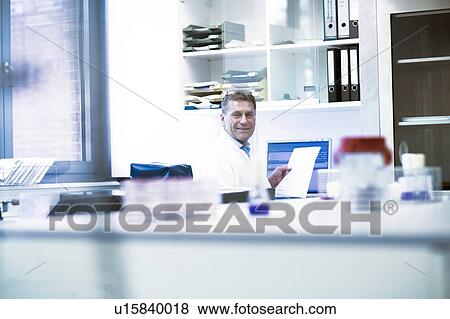 Stock Photo - Happy scientist in laboratory. Fotosearch