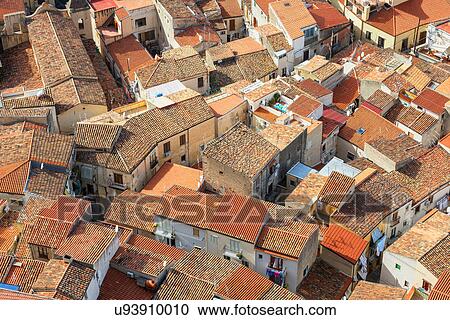 Stock Image - High angle view of Cefalu terracotta rooftops from La Rocca, Sicily, Italy. Fotosearch