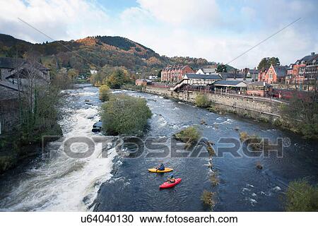 High angle view of two kayakers at the edge of River Dee rapids, Llangollen, North Wales View Large Photo Image Stock Image - High angle view of two kayakers at the edge of River Dee rapids, Llangollen, North Wales. Fotosearch