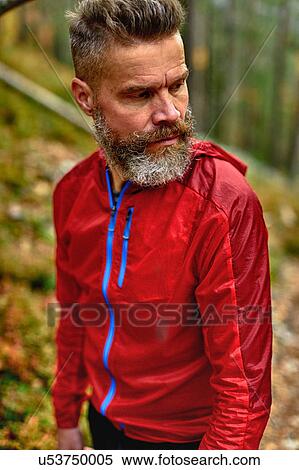 Stock Photography - Hiker looking back in forest, Kesankitunturi, Lapland, Finland. Fotosearch
