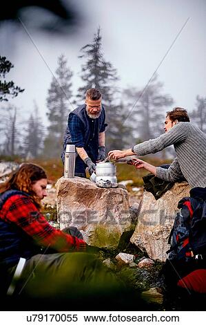 Hikers cooking in park, Sarkitunturi, Lapland, Finland View Large Photo Image Stock Photography - Hikers cooking in park, Sarkitunturi, Lapland, Finland. Fotosearch