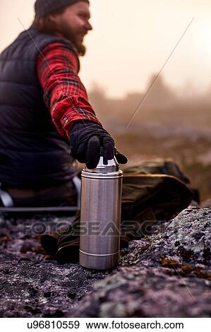 Hiker's hand resting on coffee flask, Sarkitunturi, Lapland, Finland View Large Photo Image Stock Photo - Hiker's hand resting on coffee flask, Sarkitunturi, Lapland, Finland. Fotosearch