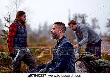 Stock Photo - Hikers relaxing in park, Sarkitunturi, Lapland, Finland. Fotosearch