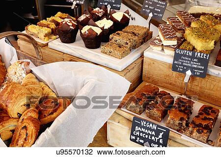 Independent coffee shop with display of vegan and gluten-free cakes View Large Photo Image Stock Image - Independent coffee shop with display of vegan and gluten-free cakes. Fotosearch