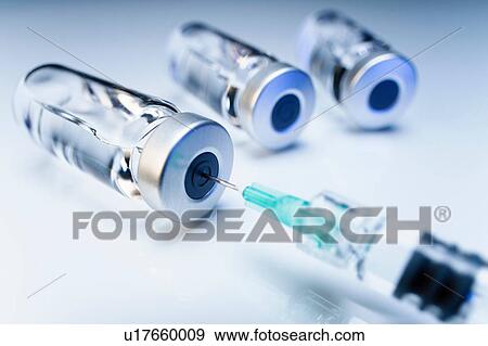 Injectable medications in sealed vials and a disposable plastic medical syringe View Large Photo Image Stock Photo - Injectable medications in sealed vials and a disposable plastic medical syringe. Fotosearch