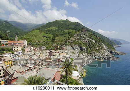 Stock Image - Italy, CinqueTerre, Vernazza, Landscape with town on coast. Fotosearch