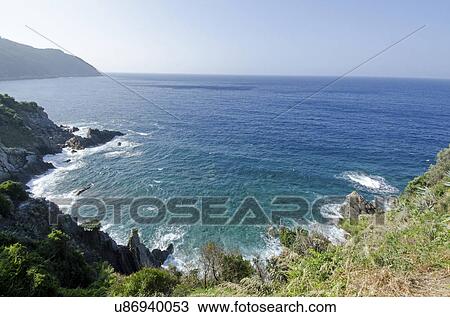 Stock Image - Italy, Liguria, Sestri Levante, Clear sky over sea, view from hill. Fotosearch