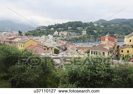 Stock Photo - Italy, Liguria, Sestri Levante, Cloudy sky over town. Fotosearch