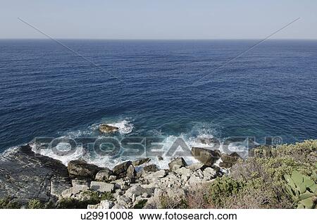 Stock Photo - Italy, Liguria, Sestri Levante, Stones by sea. Fotosearch