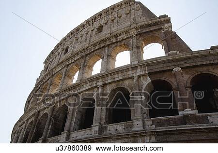 Stock Photo - Italy, Rome, Clear sky over Colosseum. Fotosearch