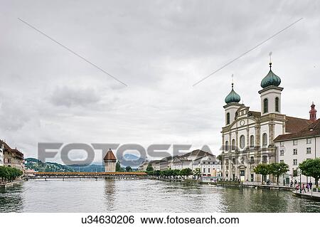 Stock Photograph - Kapellbrucke (Chapel Bridge) and water tower, with Jesuitenkirche on right, Lucerne, Switzerland. Fotosearch