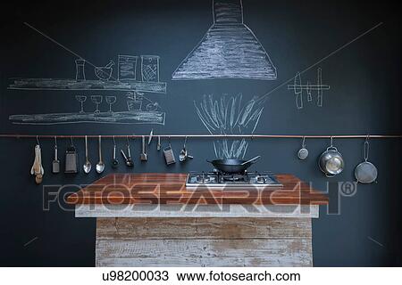 Stock Image - Kitchen with chalkboard wall background. Fotosearch