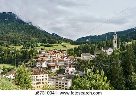 Stock Image - Landscape view with mountain valley village, Tiefencastel, Switzerland. Fotosearch