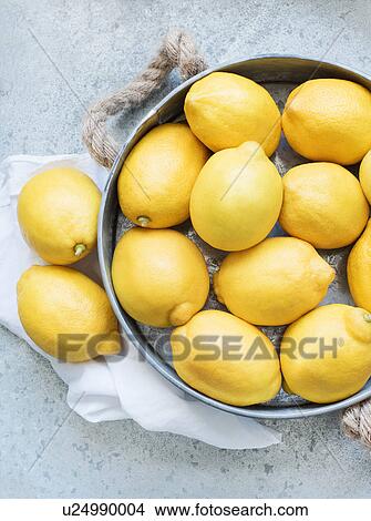 Lemons in metal container View Large Photo Image Picture - Lemons in metal container. Fotosearch