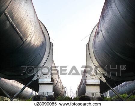 Low angle view between two hydroelectric industrial pipes, Tasmania View Large Photo Image Stock Photography - Low angle view between two hydroelectric industrial pipes, Tasmania. Fotosearch