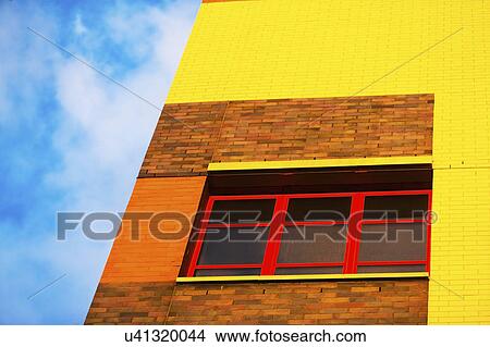 Low angle view of yellow facade View Large Photo Image Picture - Low angle view of yellow facade. Fotosearch