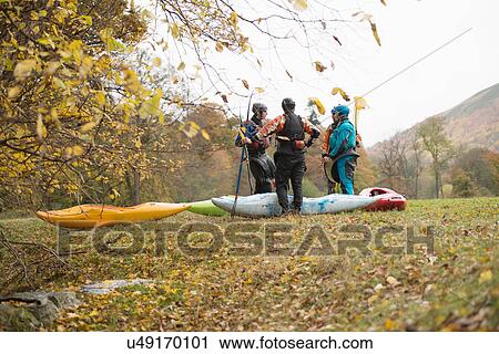 Male and female kayakers having team talk, Llangollen, North Wales View Large Photo Image Stock Image - Male and female kayakers having team talk, Llangollen, North Wales. Fotosearch