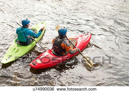 Male and female kayakers paddling on River Dee View Large Photo Image Stock Photograph - Male and female kayakers paddling on River Dee. Fotosearch