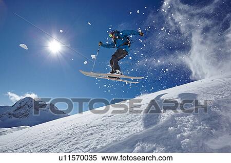 Male freestyle skier jumping mid air from mountainside, Zugspitze, Bayern, Germany View Large Photo Image Stock Photography - Male freestyle skier jumping mid air from mountainside, Zugspitze, Bayern, Germany. Fotosearch