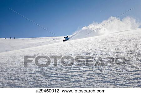 Male snowboarder snowboarding down mountain, Trient, Swiss Alps, Switzerland View Large Photo Image Stock Image - Male snowboarder snowboarding down mountain, Trient, Swiss Alps, Switzerland. Fotosearch