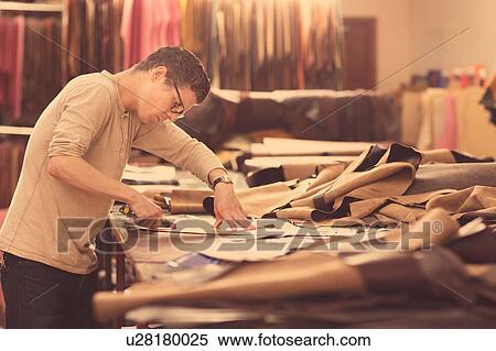 Man cutting leather with utility knife in leather jacket manufacturers View Large Photo Image Stock Photography - Man cutting leather with utility knife in leather jacket manufacturers. Fotosearch