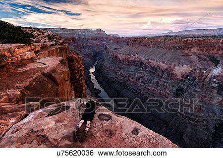 Man lying on rock, looking at view, Torroweap Overlook, Grand Canyon, Torroweap, Arizona, USA View Large Photo Image Stock Photograph - Man lying on rock, looking at view, Torroweap Overlook, Grand Canyon, Torroweap, Arizona, USA. Fotosearch