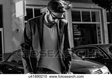 Man wearing blazer looking down, Berlin, Germany View Large Photo Image Stock Image - Man wearing blazer looking down, Berlin, Germany. Fotosearch
