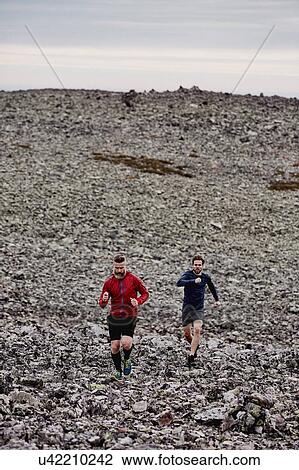 Men running on rocky cliff top, Kesankitunturi, Lapland, Finland View Large Photo Image Stock Image - Men running on rocky cliff top, Kesankitunturi, Lapland, Finland. Fotosearch